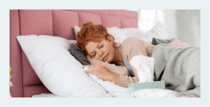 Sleep and Your Immunity Woman Sleeping with Kleenex